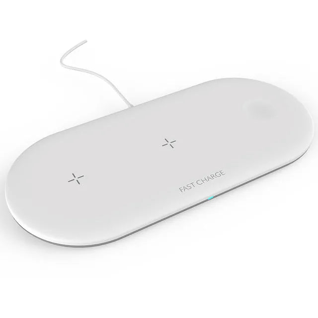 Black and white three-in-one wireless charging station for Apple iPhone, iWatch, and headphones on a desk.