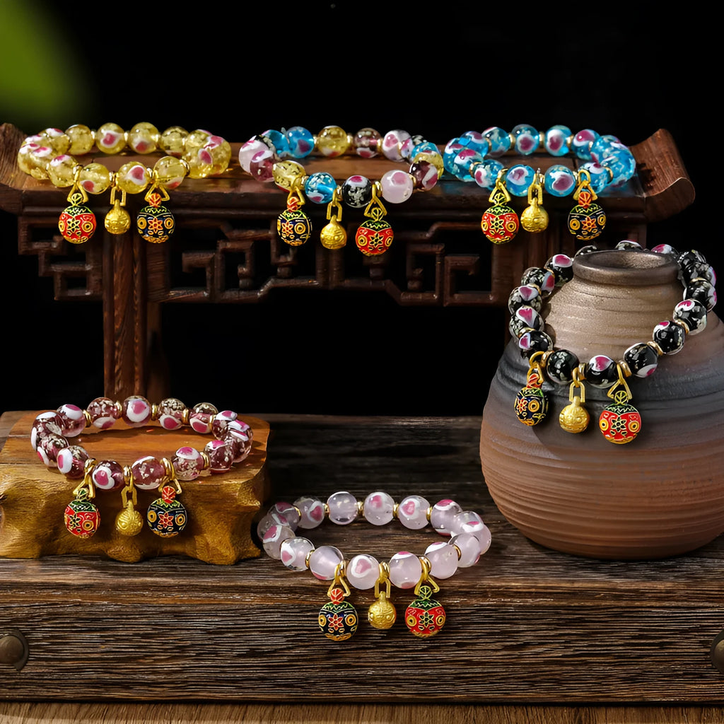 Handmade glass bracelet with swallowing gold beast charm and heart-shaped fluorescent glaze beads