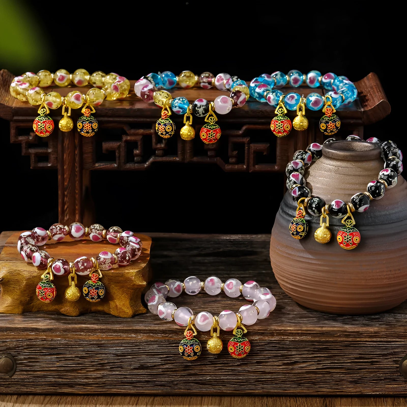 Handmade glass bracelet with swallowing gold beast charm and heart-shaped fluorescent glaze beads