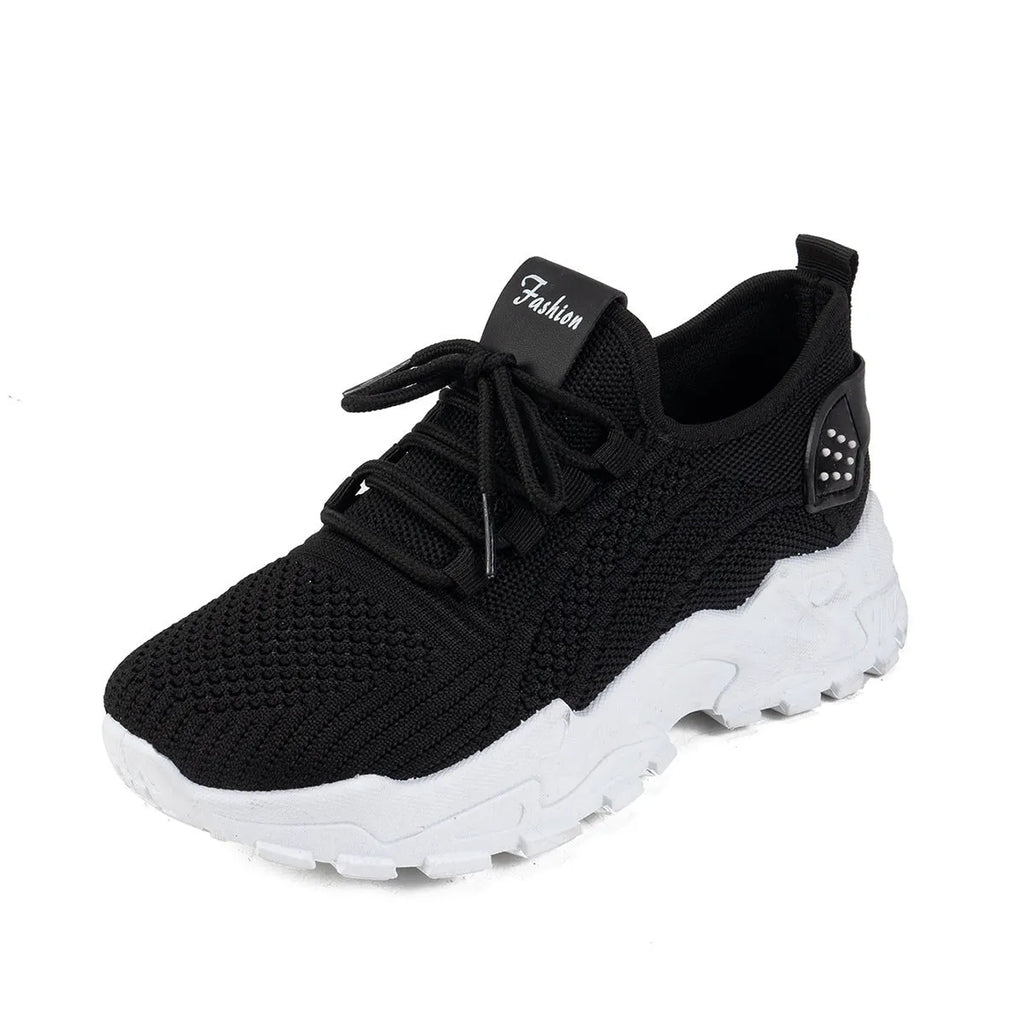 Women's white Flyknit mesh casual sports shoes with flat heel and lace-up front on a plain background.