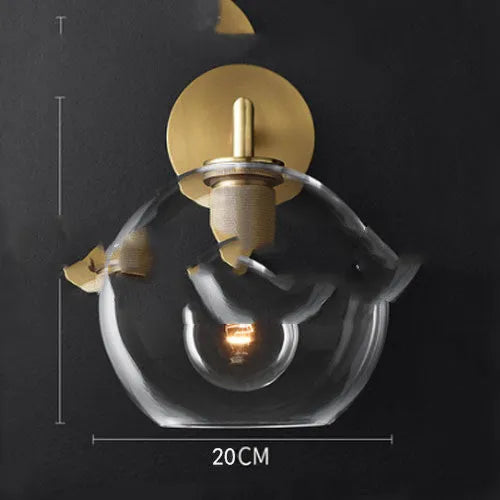 Modern wrought iron glass wall lamp with gold bronze finish and triangular transparent glass shade