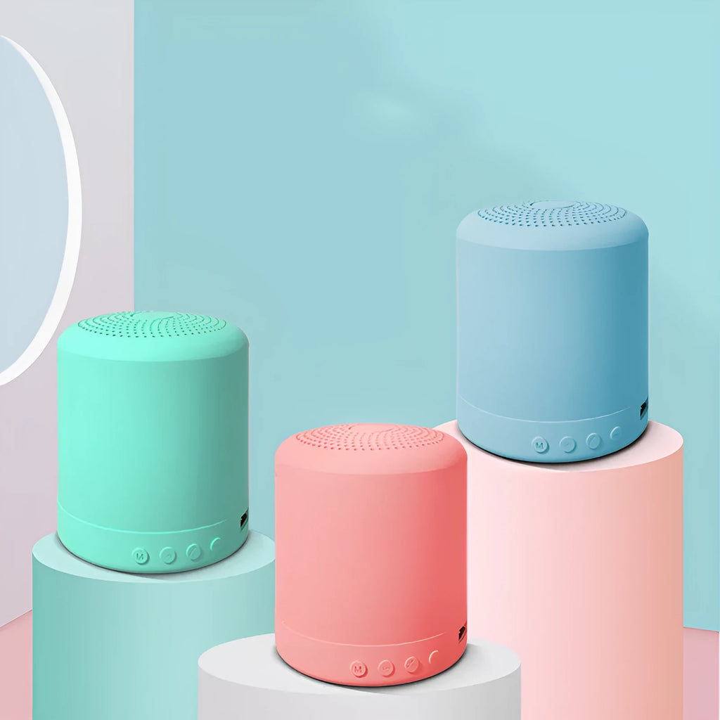 A11 compact wireless subwoofer speaker in black, pink, blue, or green colours