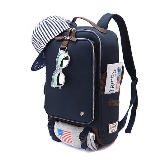 Men's modern Oxford fabric backpack in army green, showing front pockets and padded straps.