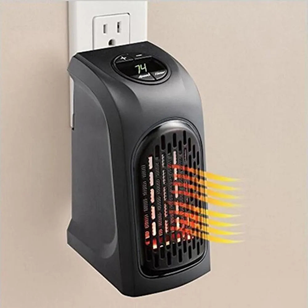 Small black ceramic fan heater on a table showing control buttons and compact size.