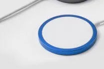 Silver anodised aluminium Magsafe-compatible wireless charger disc for iPhone