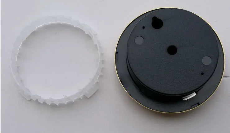 Analogue thermometer and hygrometer with aluminium dial on white background