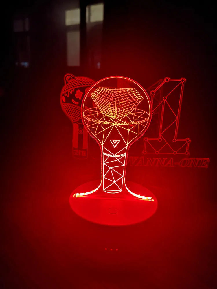 Clear acrylic stand for BTS Light 101 BTS Tower Gem album display on a table.