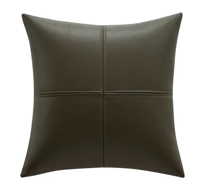 Soft cowhide leather pillow cover in a solid colour, shown in a square shape on a sofa.