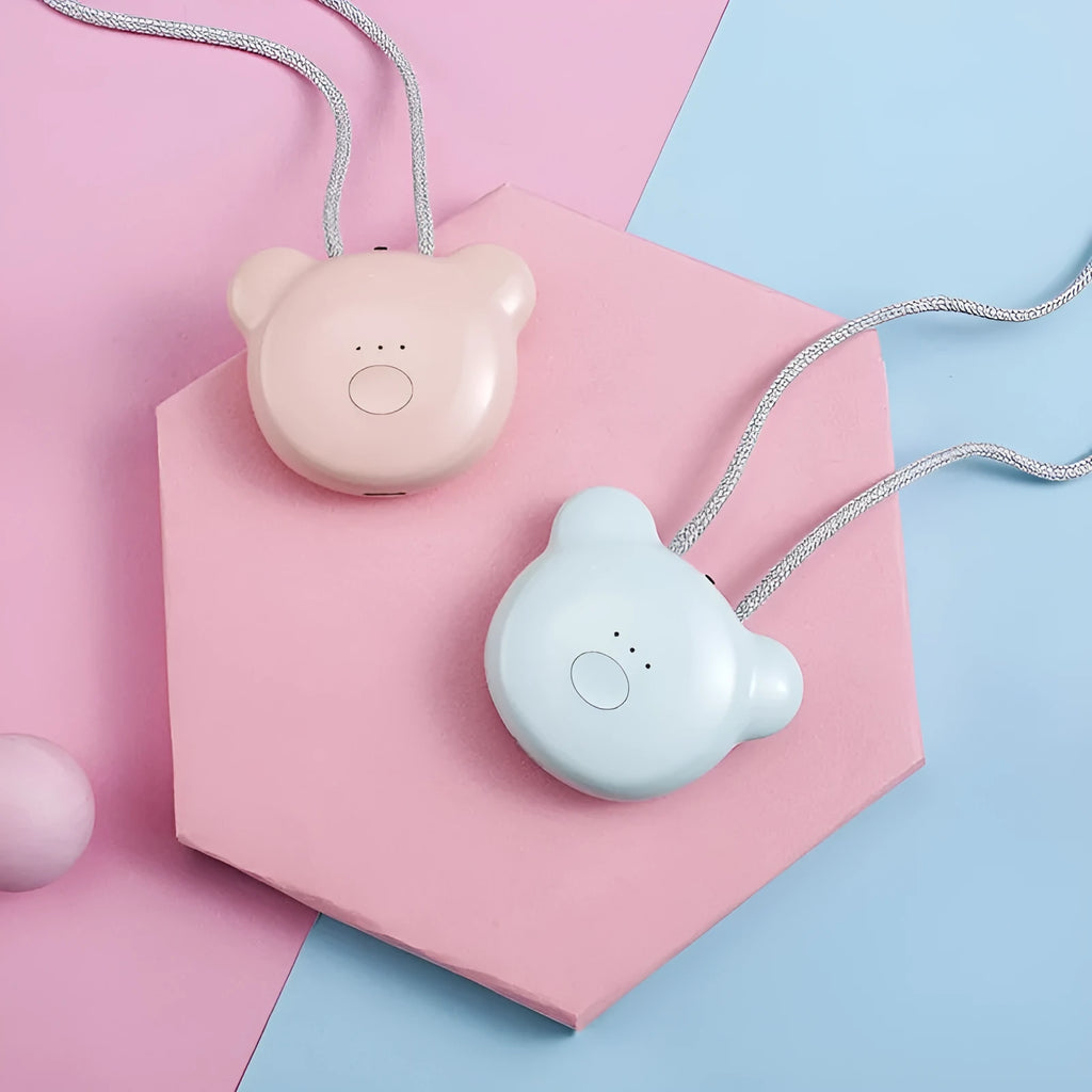 Compact USB-powered air purifier necklace in pink, showing wearable design and one-button control.