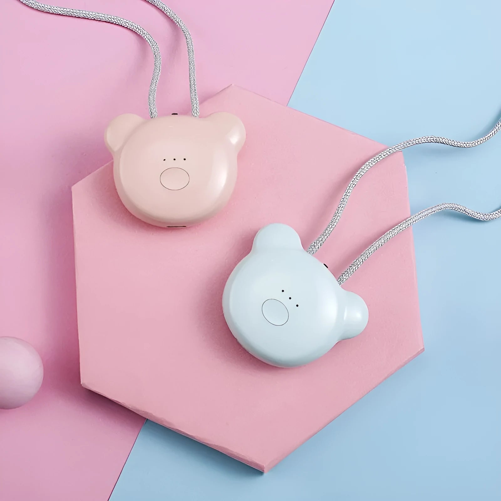 Compact USB-powered air purifier necklace in pink, showing wearable design and one-button control.