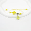 Close-up of a hand-woven glass bracelet with large 1.4cm beads containing real dried flowers.