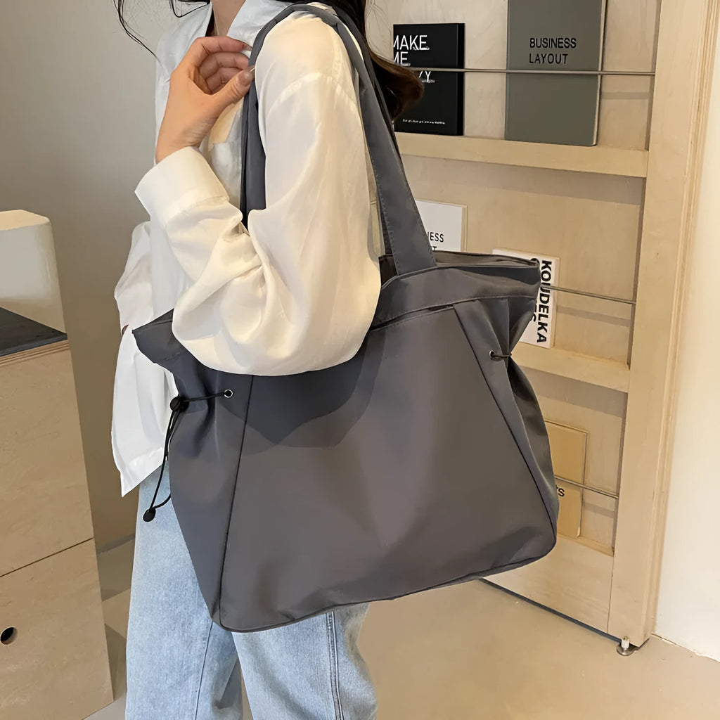 Foldable Oxford cloth commuter tote bag in street trend style, shown in multiple colour options.