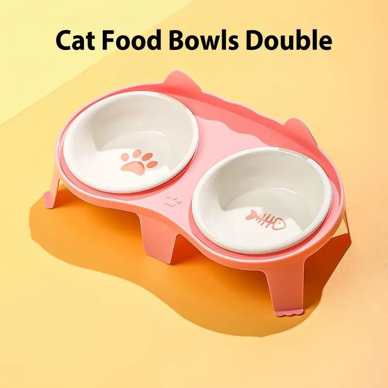 Blue ceramic cat food and water bowl set on a white stand with a hook, showing tilted feeding angle.