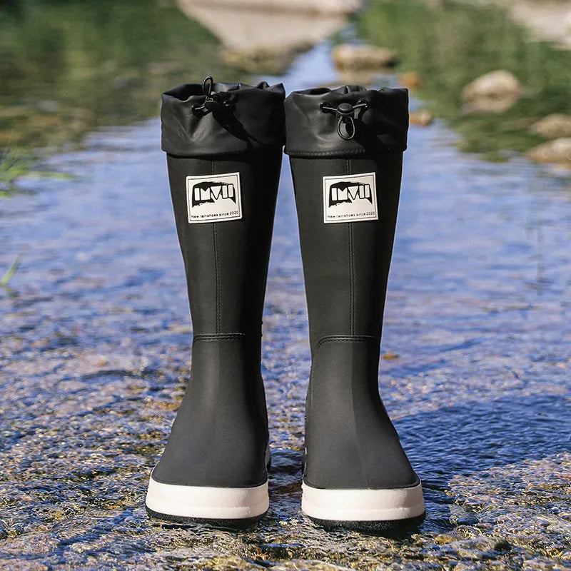 Solid colour high tube PVC rain boot in beige, shown on a white background.