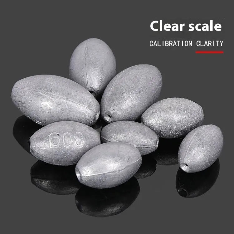 Olive-coloured rugby-shaped sea fishing sinker with a textured scale pattern, showing weight markings.