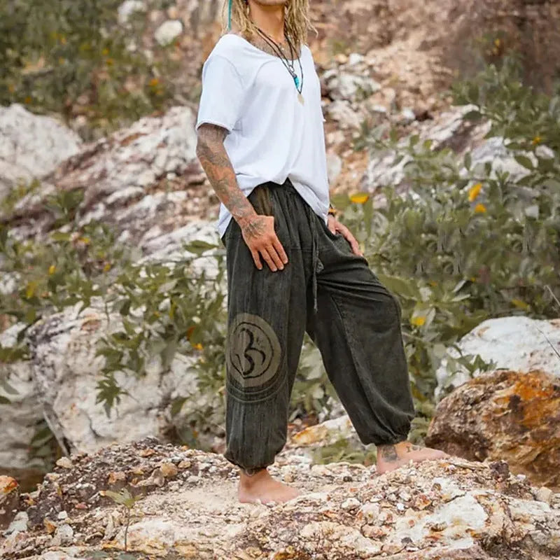 Dark green men's trousers with ethnic pattern and adjustable ankle ties