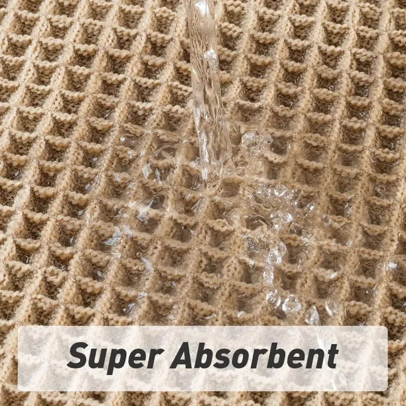 A beige checkered non-slip polyester bathroom carpet on a tiled floor.