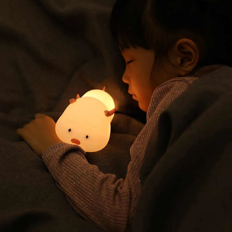 Blue silicone pig night light with sleeping expression and rechargeable battery