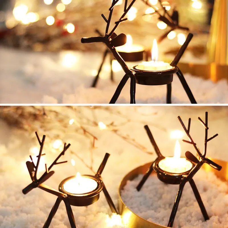 Black iron Christmas deer candlestick holder with elk silhouette on a table.