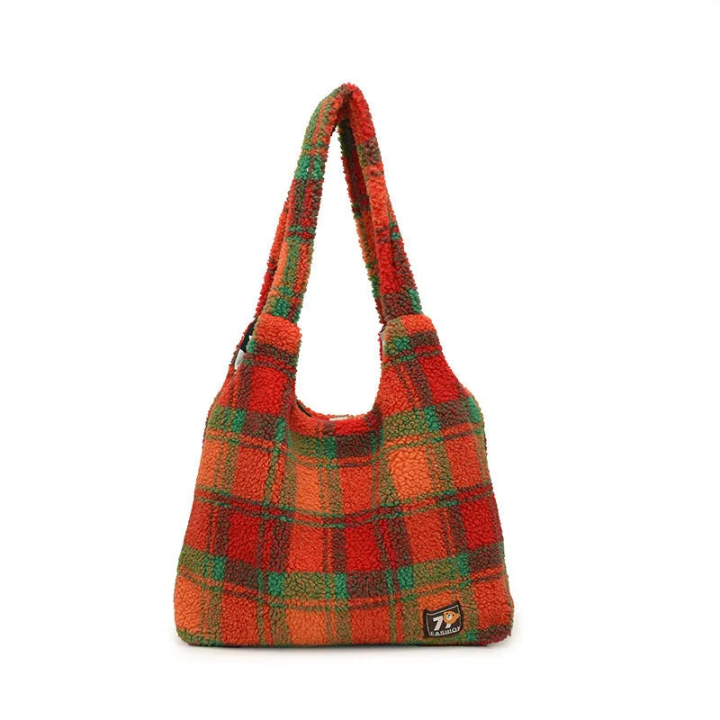 Women's plaid pattern plush crossbody tote bag showing interior zipper compartment and strap design