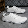 Men's solid-colour training shoes with a mesh upper, wide fit, and ribbed non-slip sole.