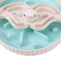 Interactive rotating slow-feed dog bowl with blue silicone licking mat in a windmill pattern.