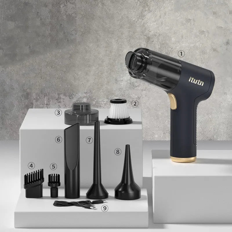 Black wireless car vacuum cleaner with multiple nozzle attachments and USB charging cable