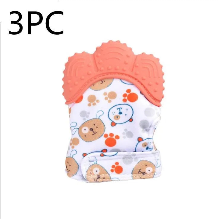 BPA-free silicone baby teether glove fastened with a white Velcro strap on a baby's hand