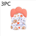 BPA-free silicone baby teether glove fastened with a white Velcro strap on a baby's hand