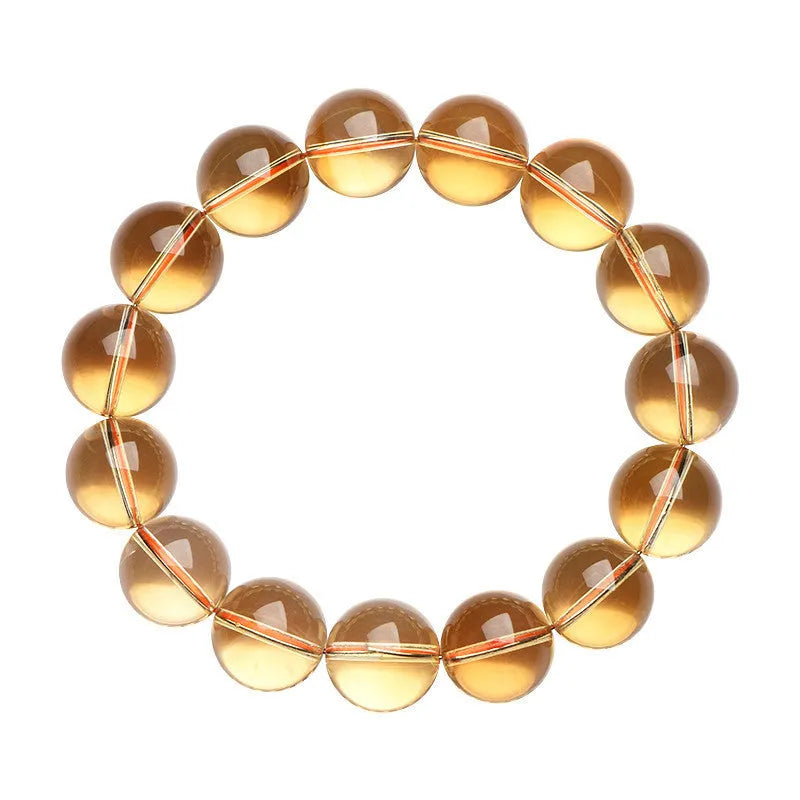 Adjustable natural citrine scattered beads bracelet on a wrist, showing polished yellow gemstones in an organic pattern.