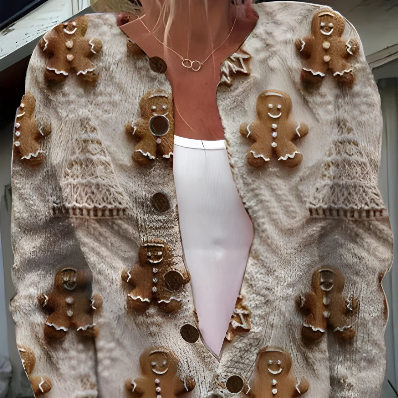 Loose-fit short-sleeve shirt with a lapel collar and a printed design, shown on a hanger.