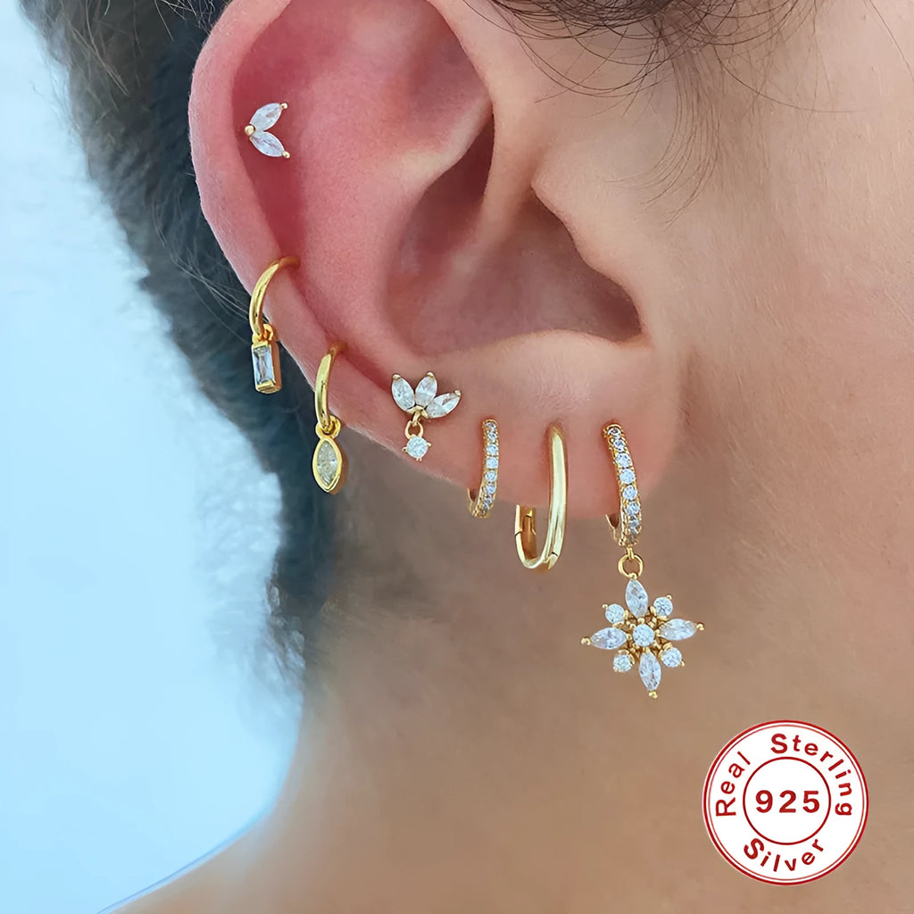 Sterling silver snowflake pendant earrings with gemstones in yellow or white gold plating.