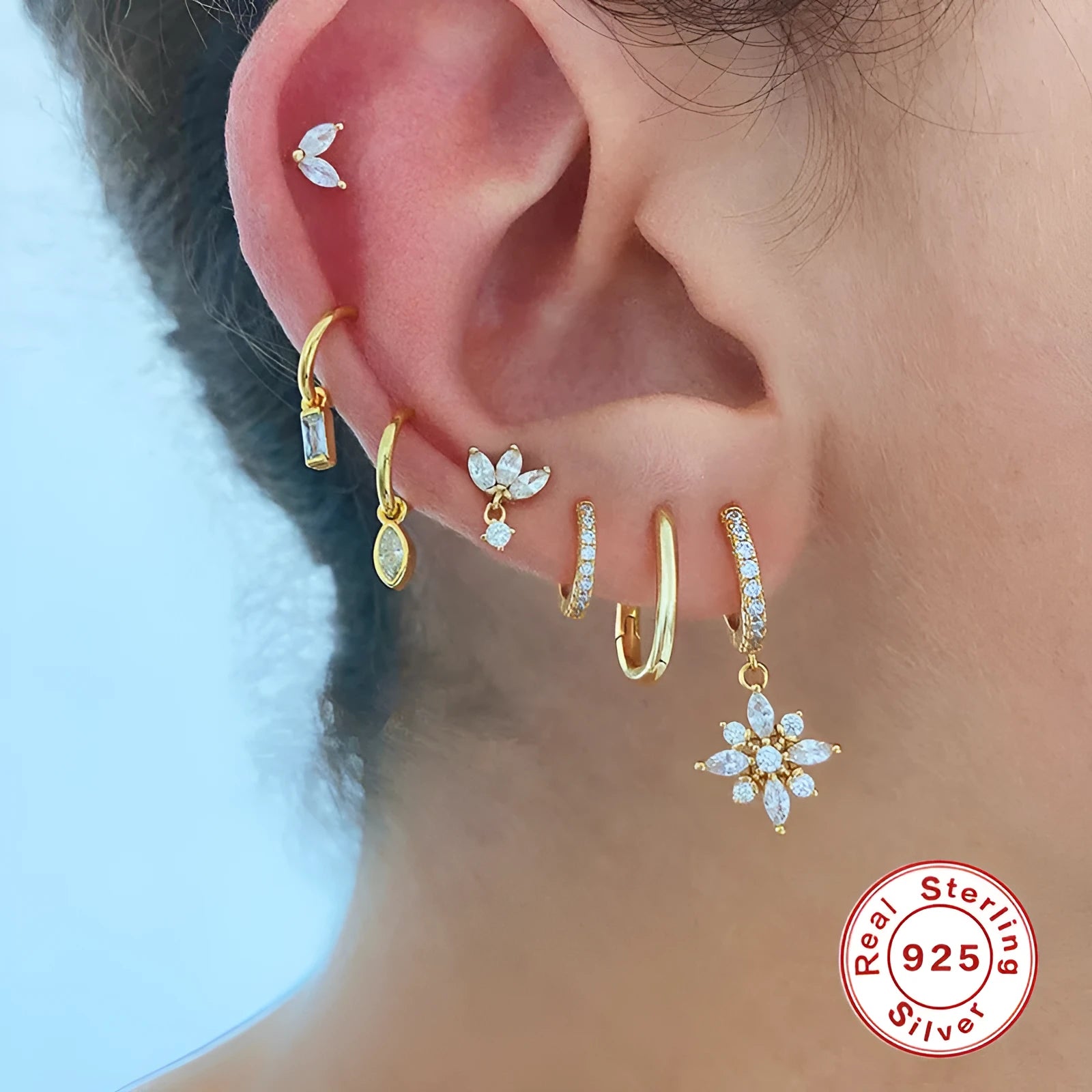 Sterling silver snowflake pendant earrings with gemstones in yellow or white gold plating.