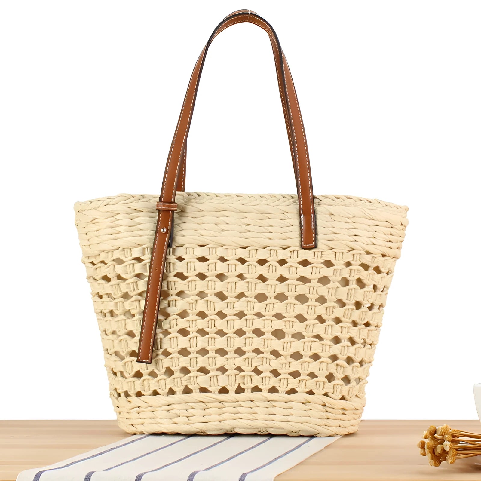 Horizontal square shoulder bag woven from paper-string with adjustable strap in beige colour