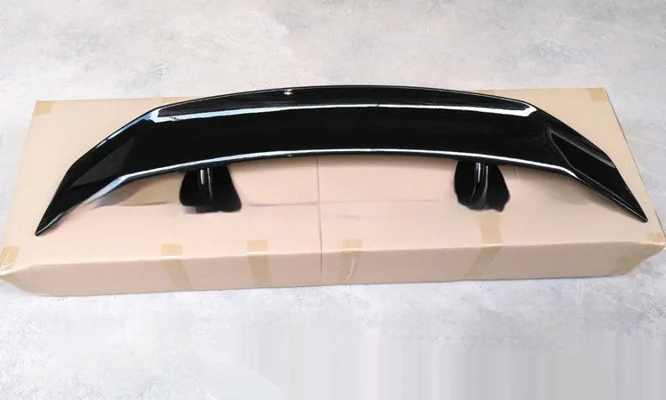 Universal punch-free fixed air design car spoiler tail wing in ABS plastic shown in various finish options.