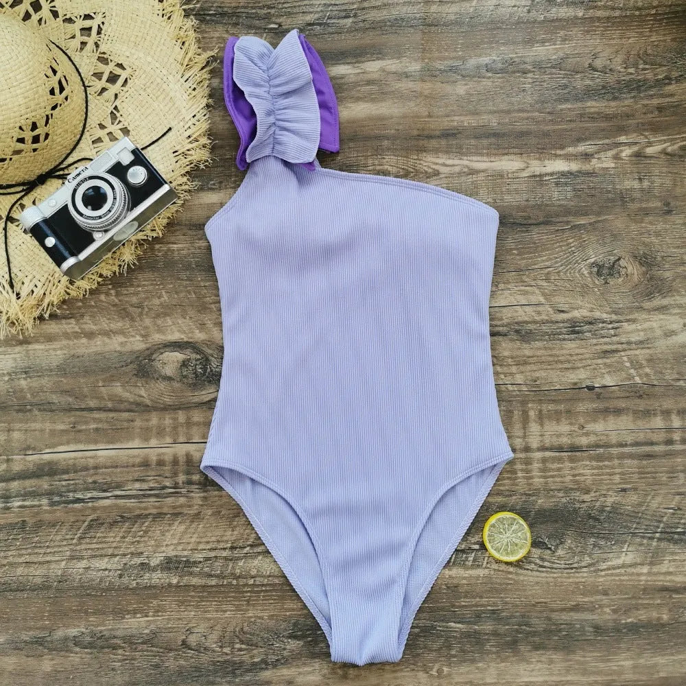 Women's single-shoulder high-waisted one-piece swimsuit in solid colour.