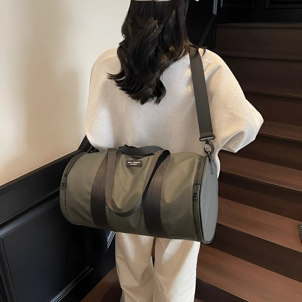 Waterproof Oxford cloth travel bag for sports and leisure in black, dark gold, and dark grey colours