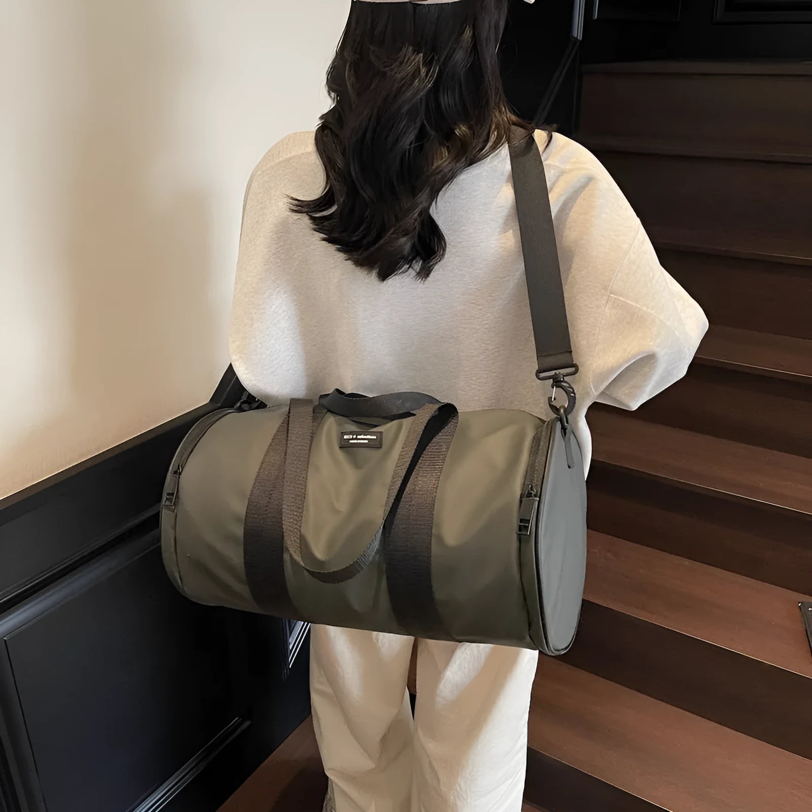 Waterproof Oxford cloth travel bag for sports and leisure in black, dark gold, and dark grey colours