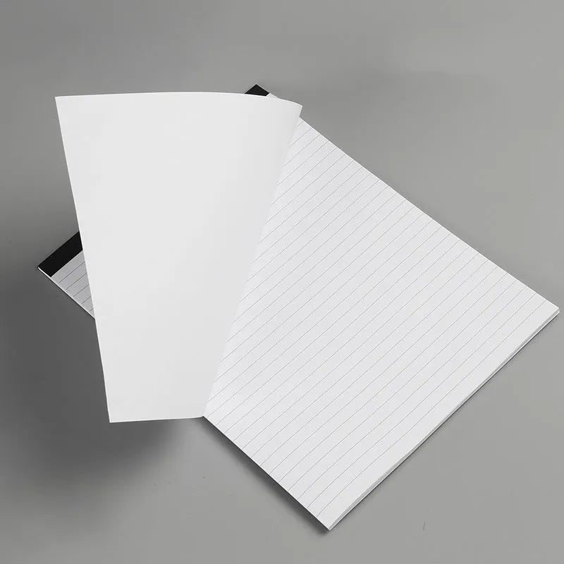 A4 tearable notebook with a paper cover and ivory white grid pages, showing adhesive binding.