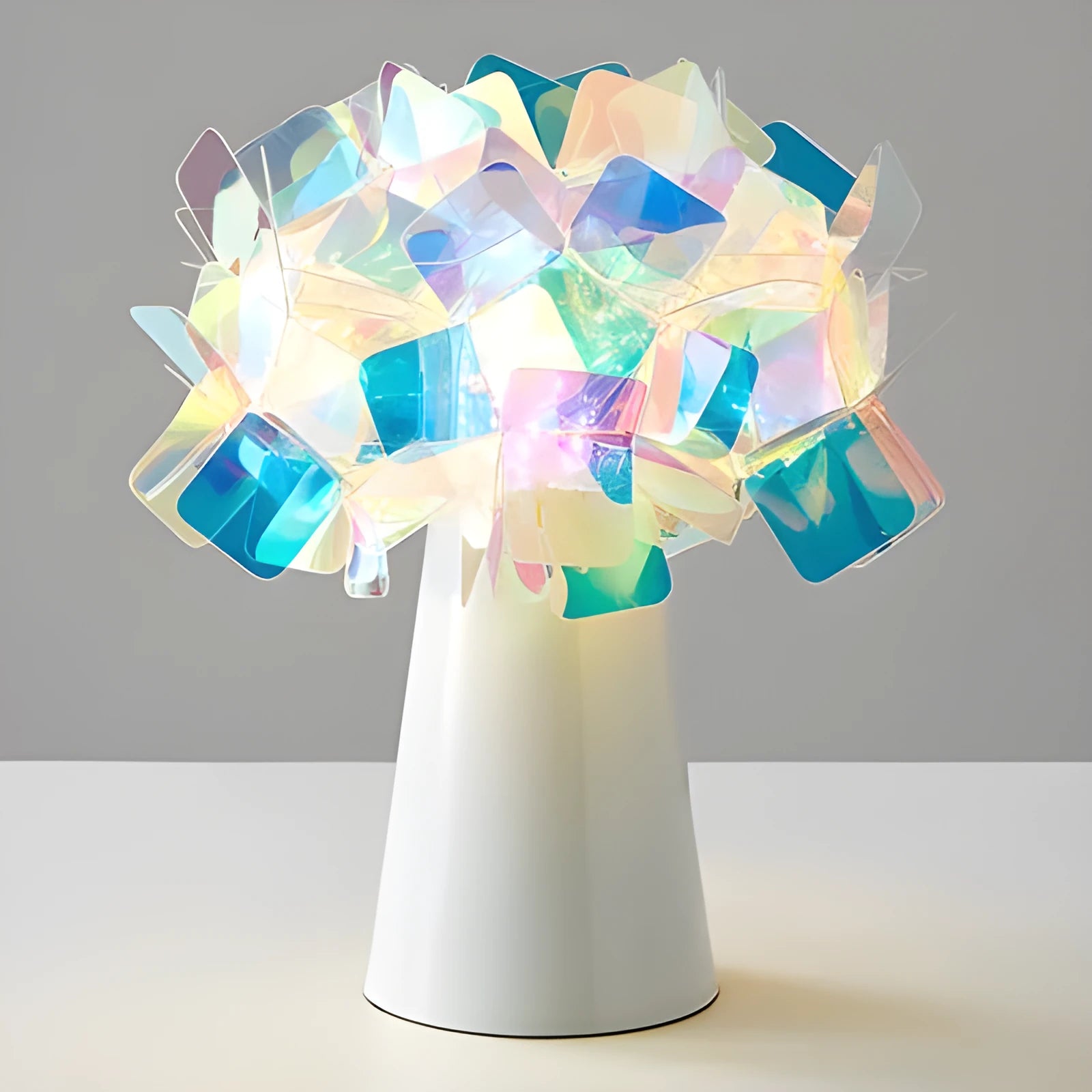 Simple Nordic style table lamp with metal base in assorted colours on a wooden table.