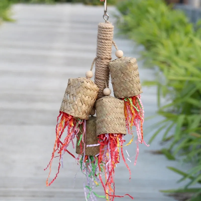 Shredded paper bird toy with colourful paper strips on wooden frame with sisal rope, measuring 15 by 35cm