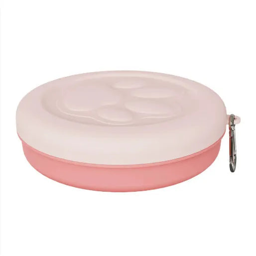 Portable dual-compartment dog food and water bowl in light pink and green colour options.