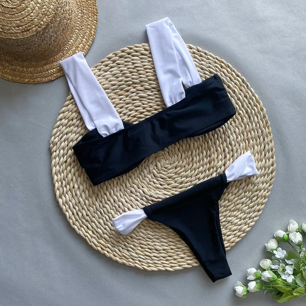 Women's black and leopard print tube top bikini set laid flat, showing the sleeveless top and briefs.