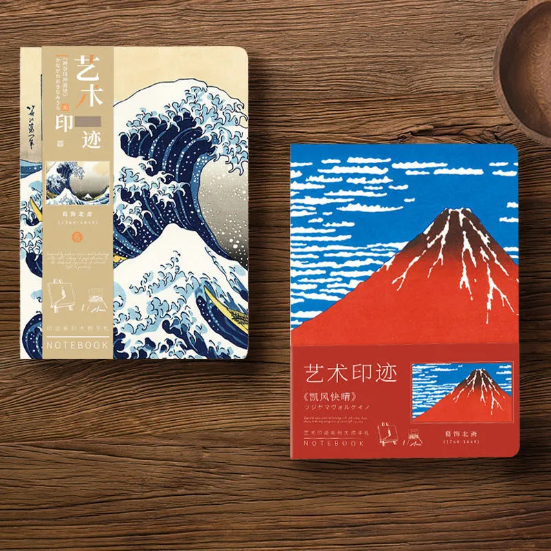Hardcover Ukiyo-e art notebook open on a desk, showing the Kanagawa wave design and A5 size.