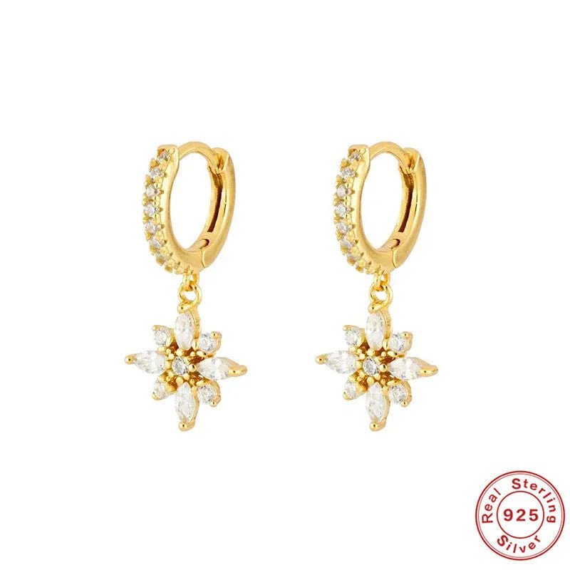 Sterling silver snowflake pendant earrings with gemstones in yellow or white gold plating.