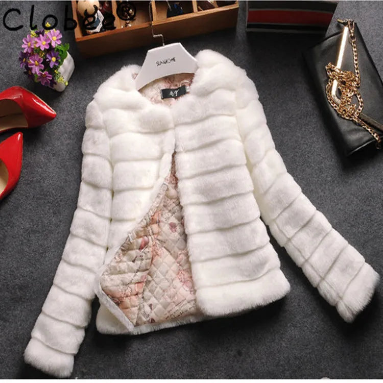 Women's short-length faux fur top in beige colour on a model, showcasing its textured fabric and regular sleeves.
