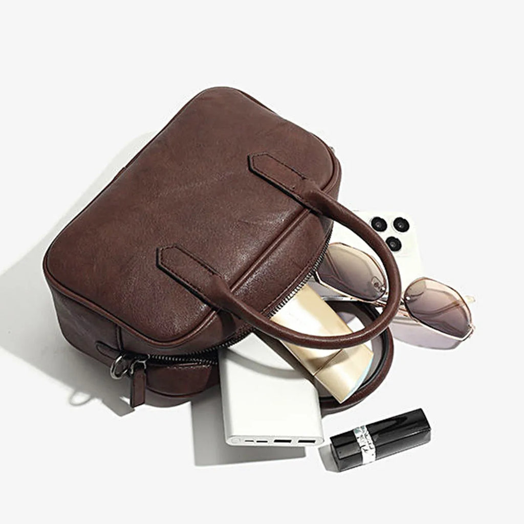 Small square retro messenger bag in black or coffee colour with single shoulder strap