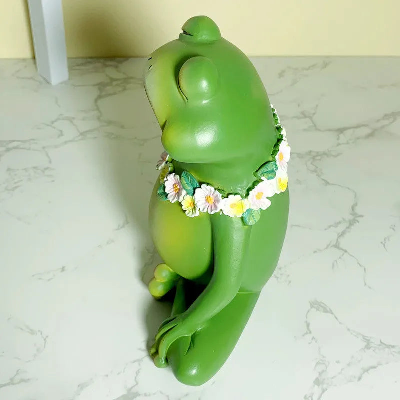 European-style plastic and resin magic yoga frog ornament in RDW123 colour on a shelf.