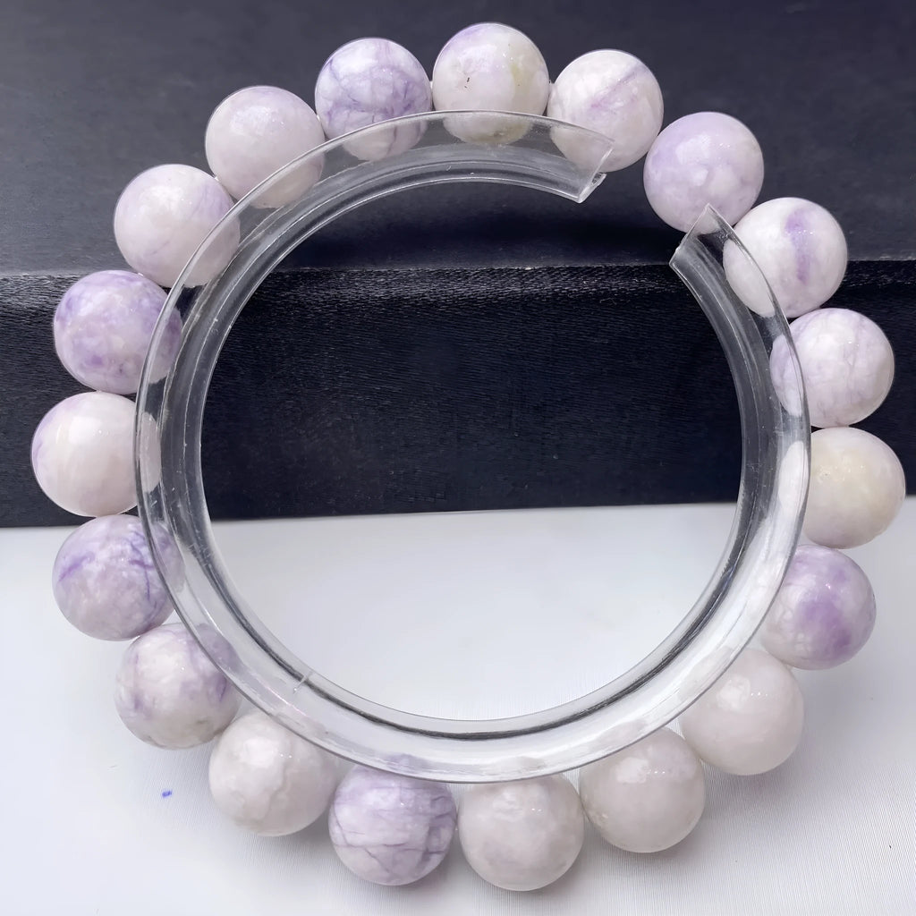 Women's natural purple turquoise bracelet showing different bead size options.