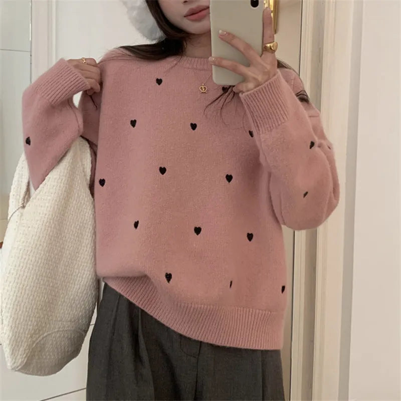 Women's loose acrylic pullover sweater with embroidered love pattern in beige, long sleeves and crew neck.